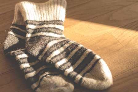 A pair of socks representing a 10-ounce weight.